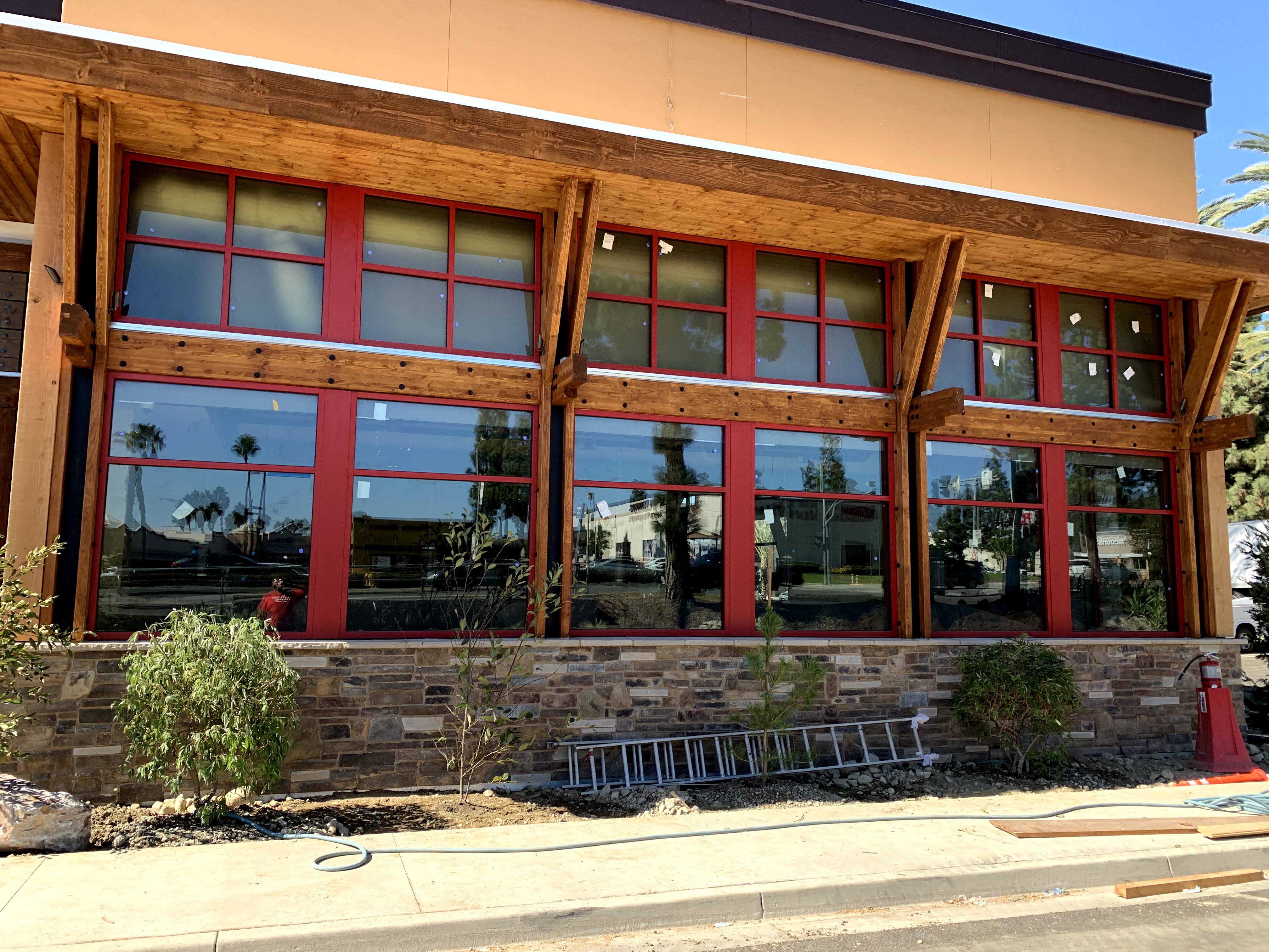 Glass storefront with red aluminum frame